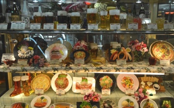 Visible menu in the display case make it pleasant and fascinating to choose food and drinks.