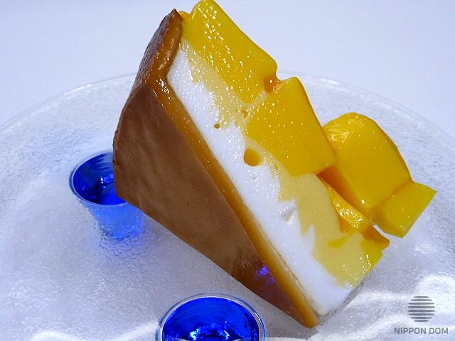 A replica of cheesecake with mango